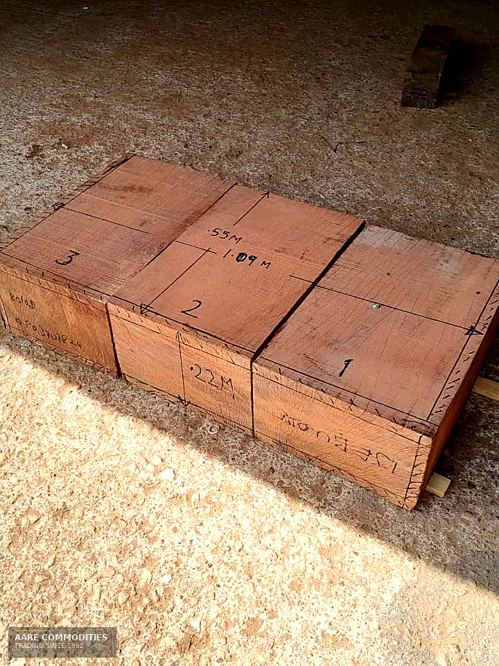 Sawn Ekki / Azobé baulks squared and butted together, marked by hand with piece numbers and dimensions of 1.09m, 0.55m and 0.22m